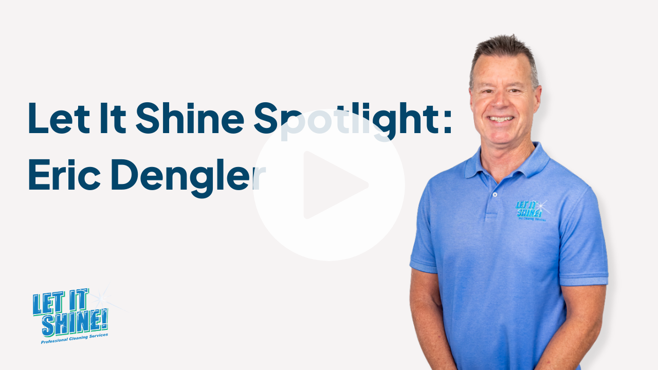 Branded promotional image with a smiling man in a light blue Let It Shine polo standing on the right against a light gray background. Large dark blue text on the left reads, “Let It Shine Spotlight: Eric Dengler.” The Let It Shine logo appears in the lower left corner, and a faint play button overlay is centered on the image.